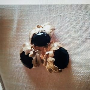 Elsa Schiaparelli gold tone black floral leaf brooch